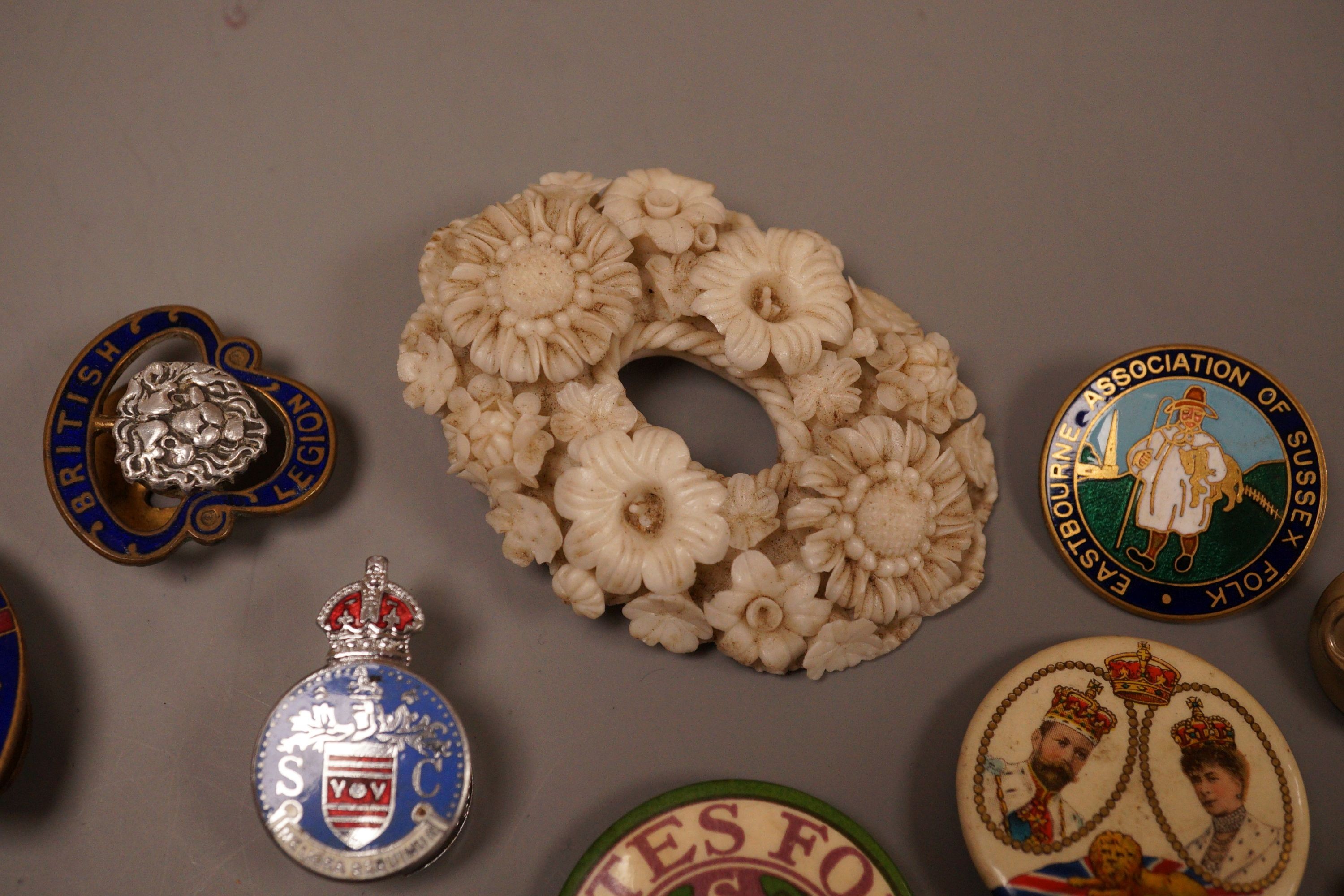 A selection of badges, to include Suffragette Women's Social and Political Union ‘Votes For Women’, Eastbourne Association of Sussex Folk, and others